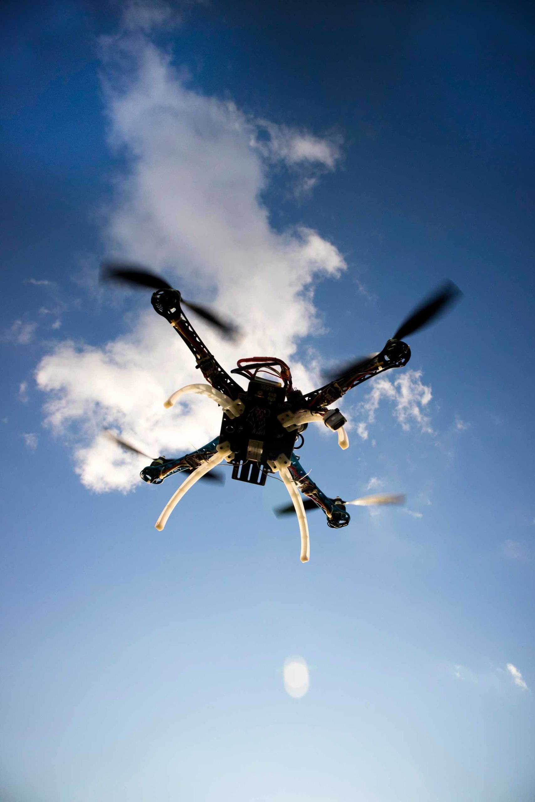 drone-in-flight-with-cloudy-sky-PTCUKNJ-scaled.jpg