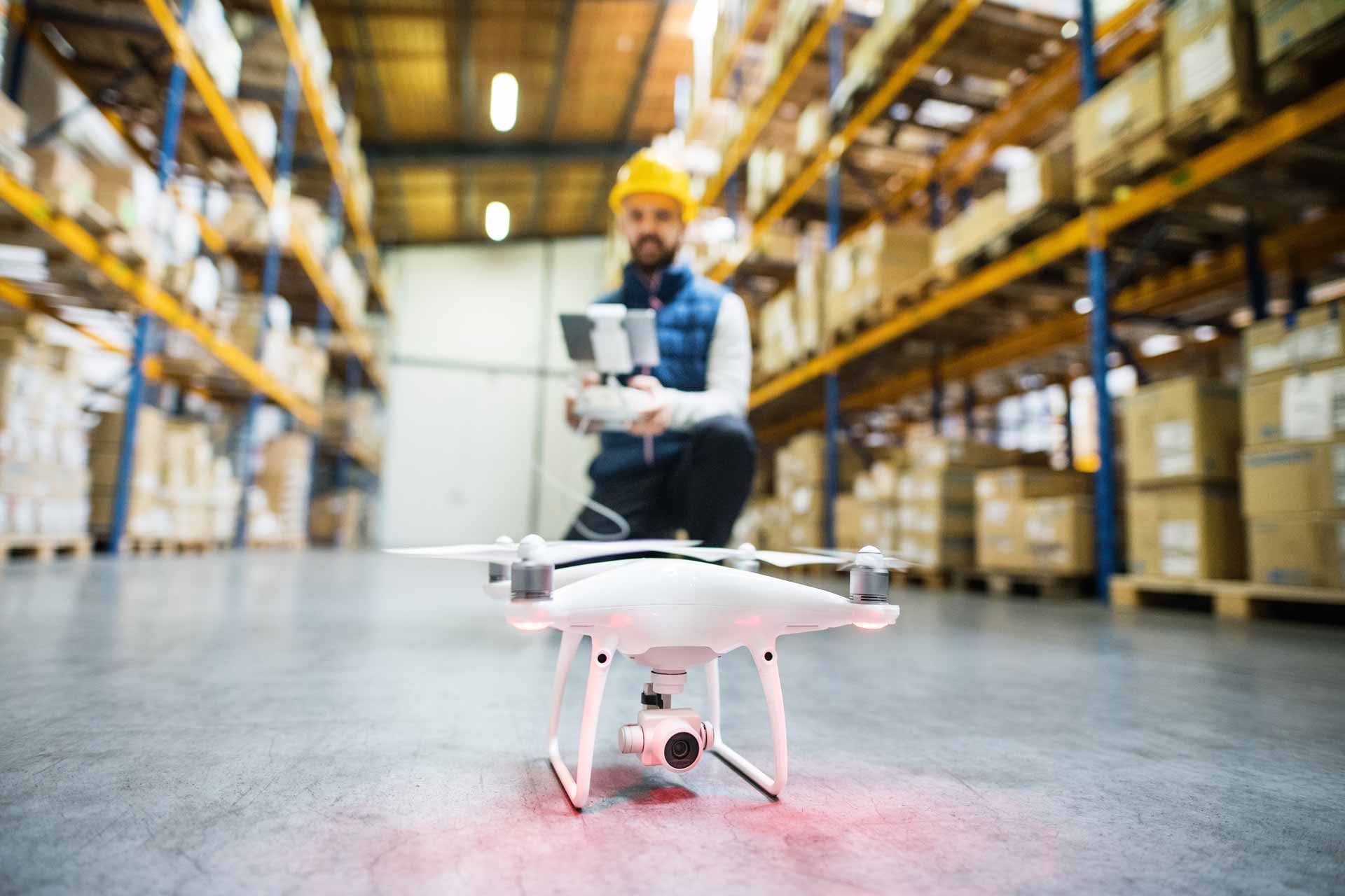man-with-drone-in-a-warehouse-PMQEJ35.jpg